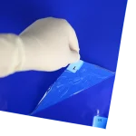 Adhesive Mats - peeling back layers of blue mat to reveal second layer