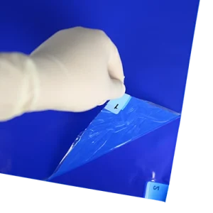 Adhesive Mats - peeling back layers of blue mat to reveal second layer