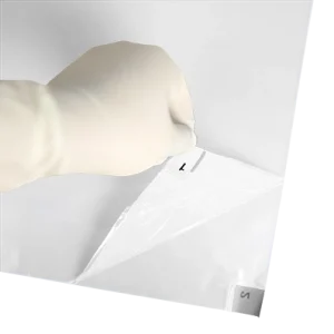 Integrity Adhesive Mat - White Color - Gloved hand peeling back mat to reveal second layer