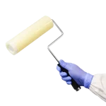 Cleanroom film roller in use - with handle - being held by cleanroom operative