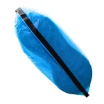 Sole of a blue ESD shoe cover, showcasing the grounding strip running along the bottom of the cover