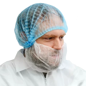 Man wearing blue pleated bouffant cap with a white beard cover and coverall