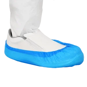Blue Cleanroom Shoe Cover over a slip-on cleanroom shoe. The cleanroom operative is also wearing cleanroom clothing on their leg