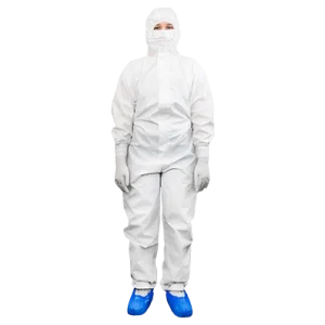 Cleanroom operative wearing a disposable coverall, mask and overshoes