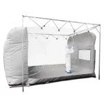 Portable cleanroom tent - shot of fully gowned cleanroom operative cleaning the inside of the tent - shot from outside the tent