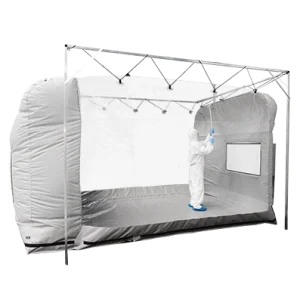 Portable cleanroom tent - shot of fully gowned cleanroom operative cleaning the inside of the tent - shot from outside the tent